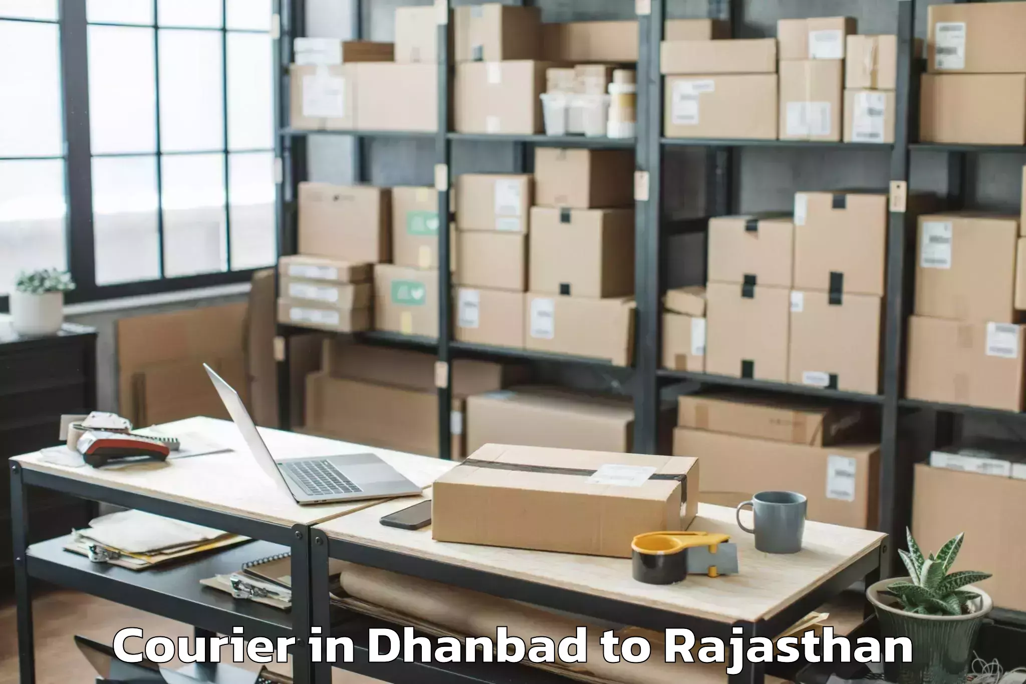 Book Dhanbad to Nadbai Courier Online